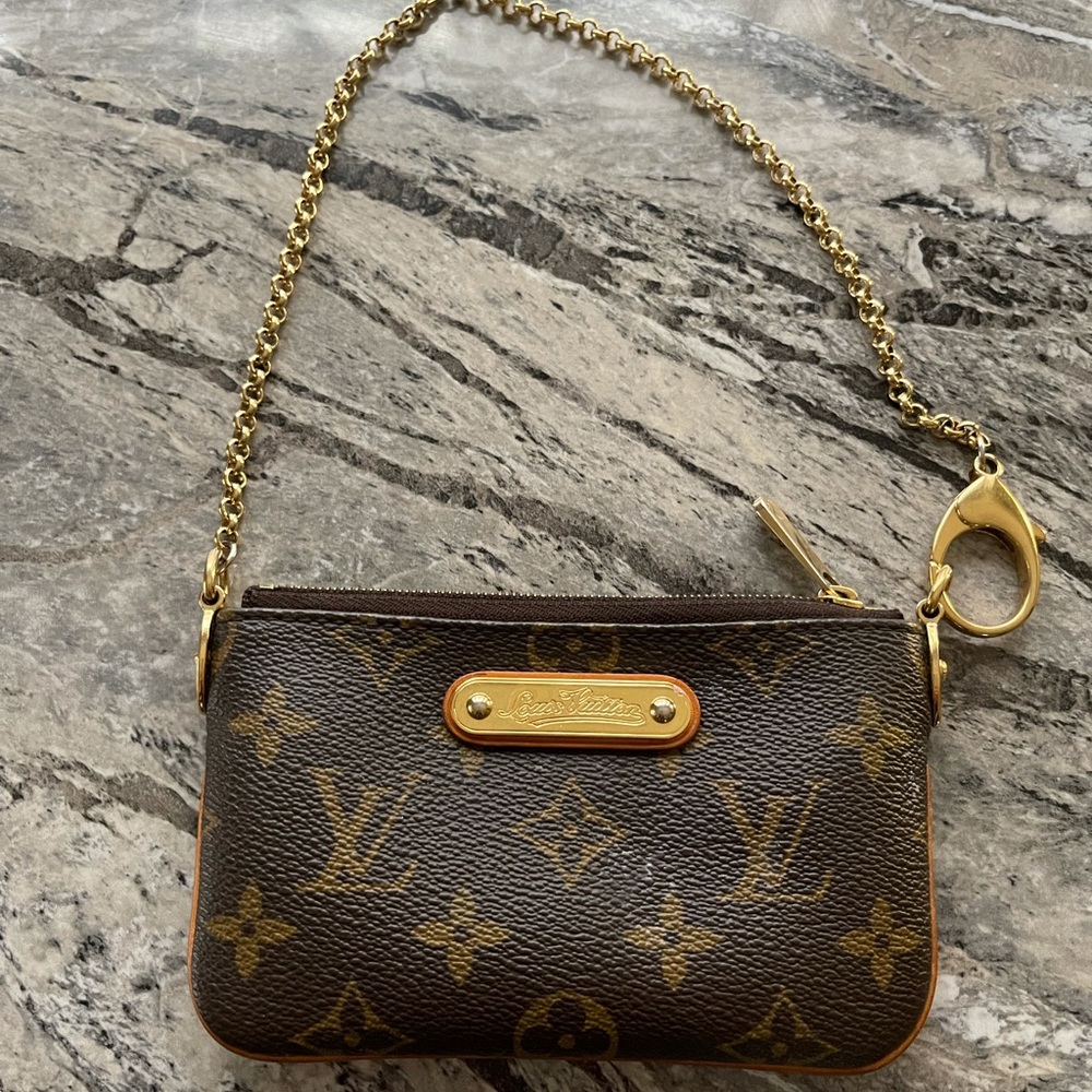 Authentic Louis Vuitton Mila pm clutch